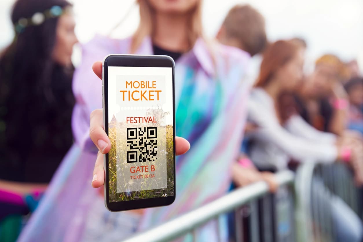 Guest presenting a mobile QR ticket at an event